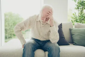 Close up portrait of grey haired he his him grandpa with chronic